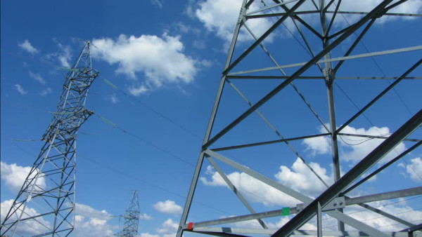 https://www.shutterstock.com/video/clip-4357886-stock-footage-tall-electric-masts-against-cloudy-sky-zoom-timelapse.html