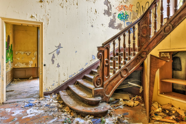 Decaying staircase in an abandoned manor