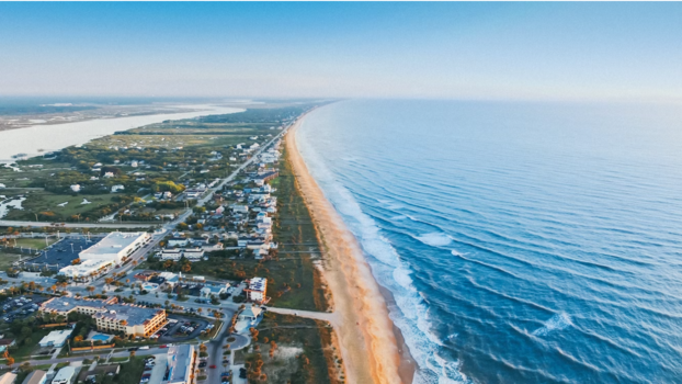 an aerial view of the beach and ocean