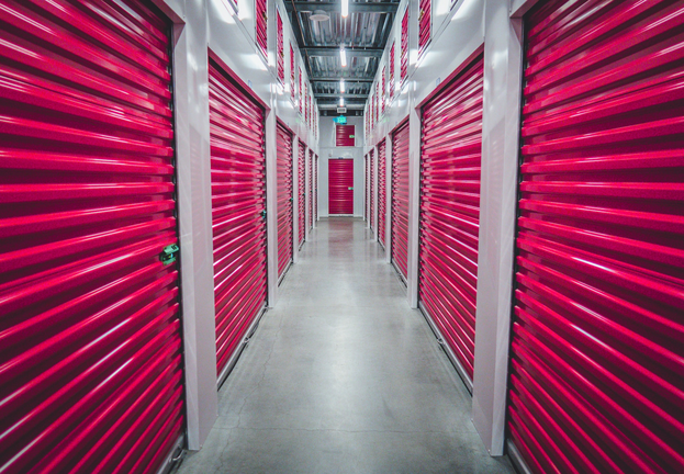 rows of red storage units in a storage facility